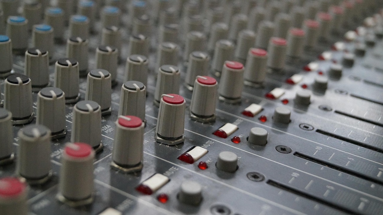 Faders and knobs on a mixing board